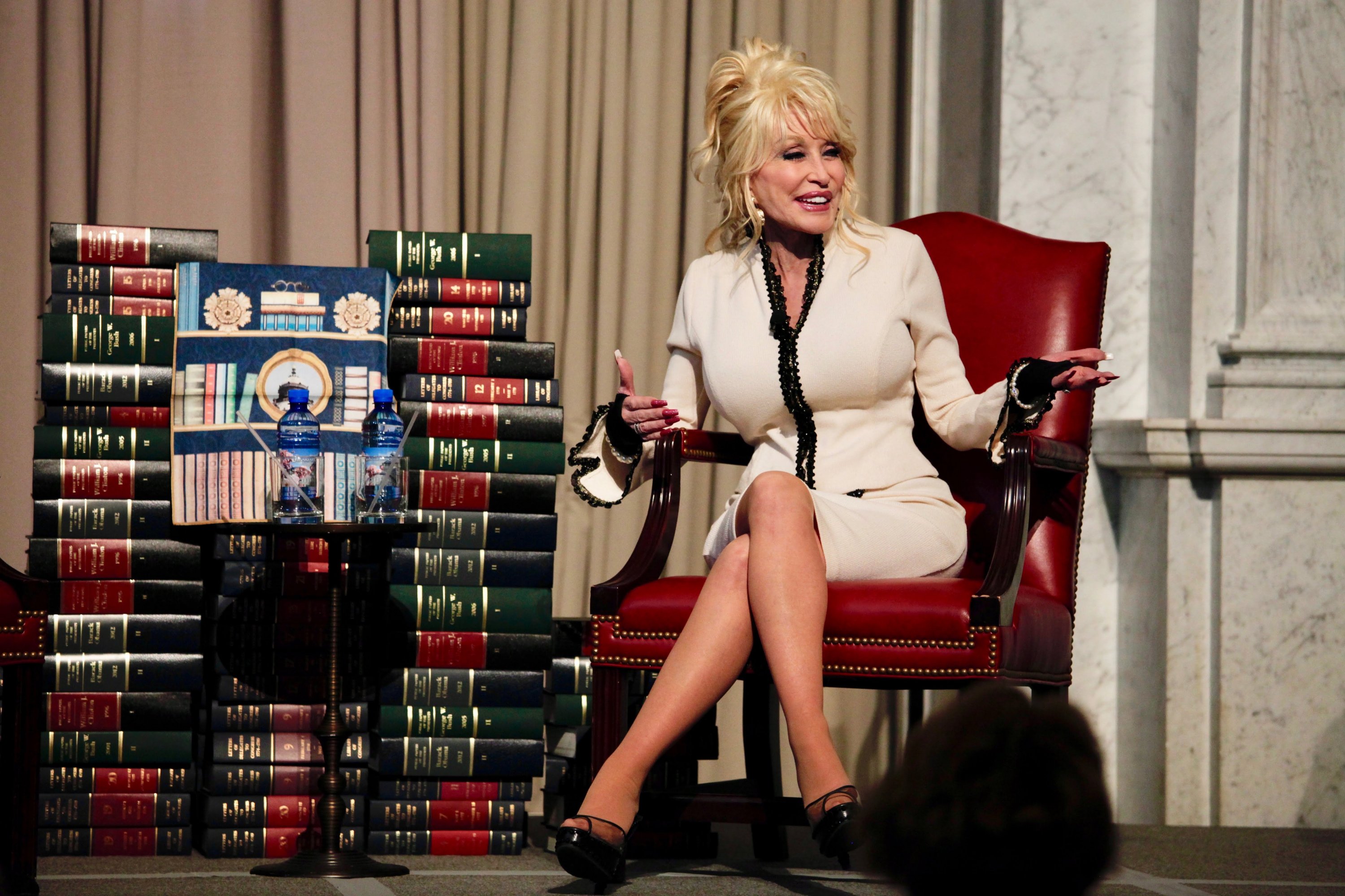 The book beneath the fabric is the 100 millionth book to be donated to the Library of Congress. 