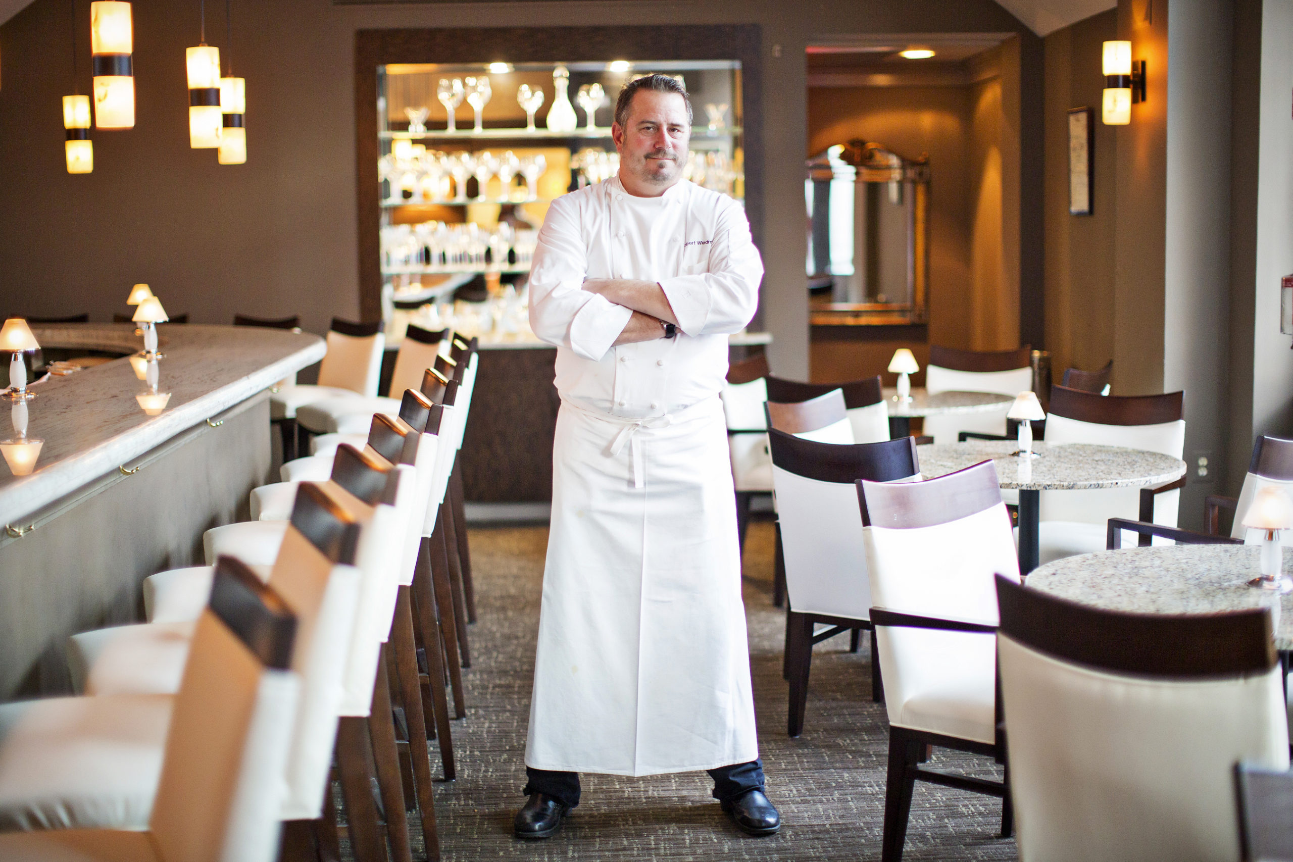 Robert Wiedmaier in lounge at Marcel's. Photograph by Scott Suchman.