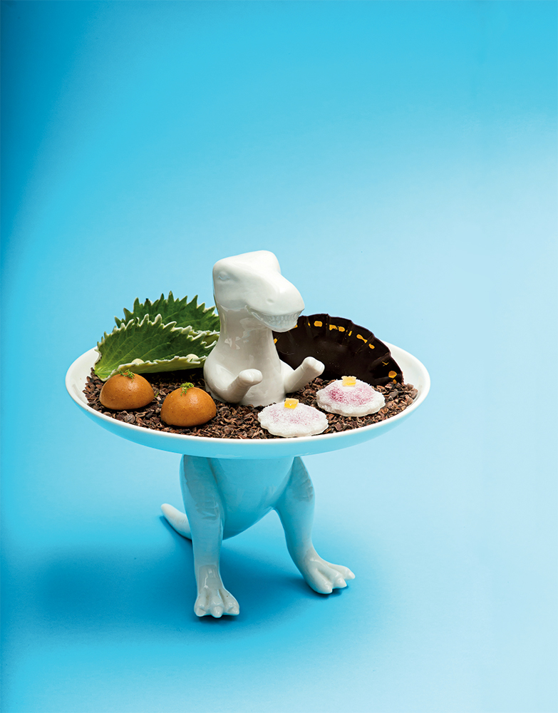 Left: Ceramic dinosaur plate for petits fours at Minibar.