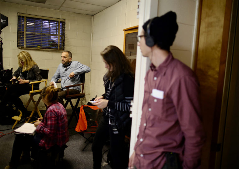 The crew watches a scene featuring Akinnagbe in real time. The crew watches a scene in real time.