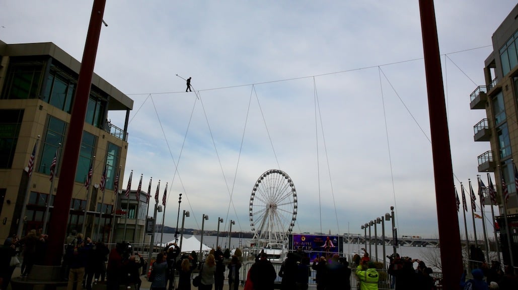Nik Wallenda walks between two buildings at the National Harbor. Photo by Evy Mages. 