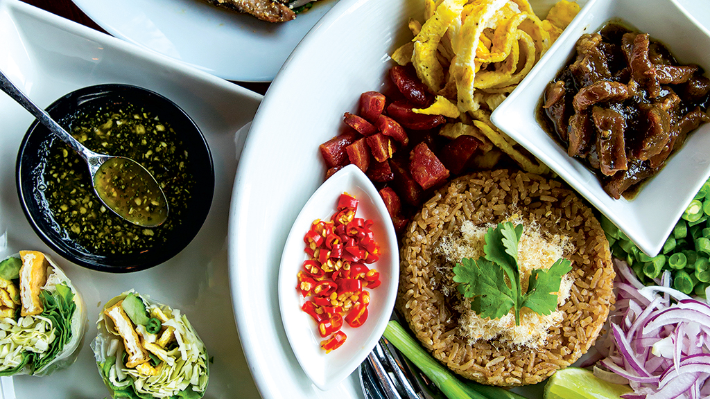 Basil-and-tofu rolls, Crying Tiger steak, and fried rice. Photograph by Scott Suchman.