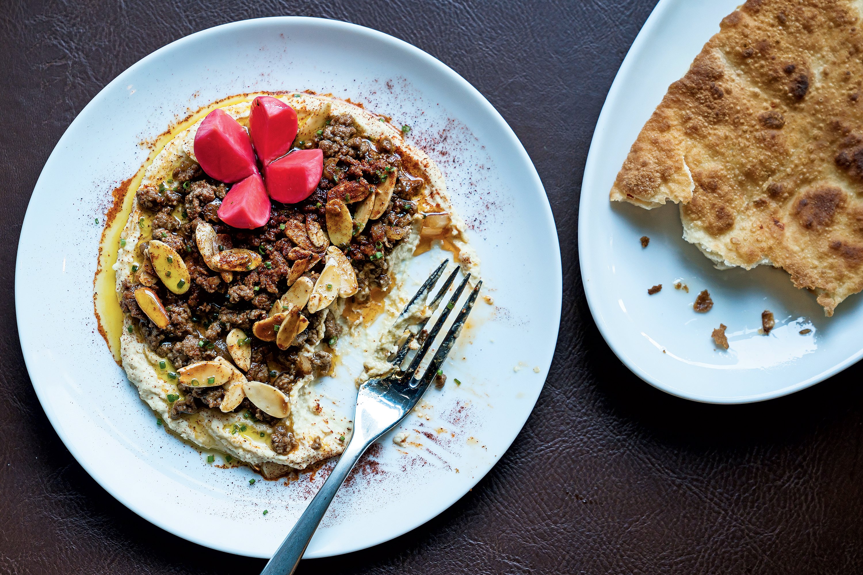Hummus with sautéed beef and snowshoe naan at the eclectic new Chloe. Photograph by Scott Suchman.