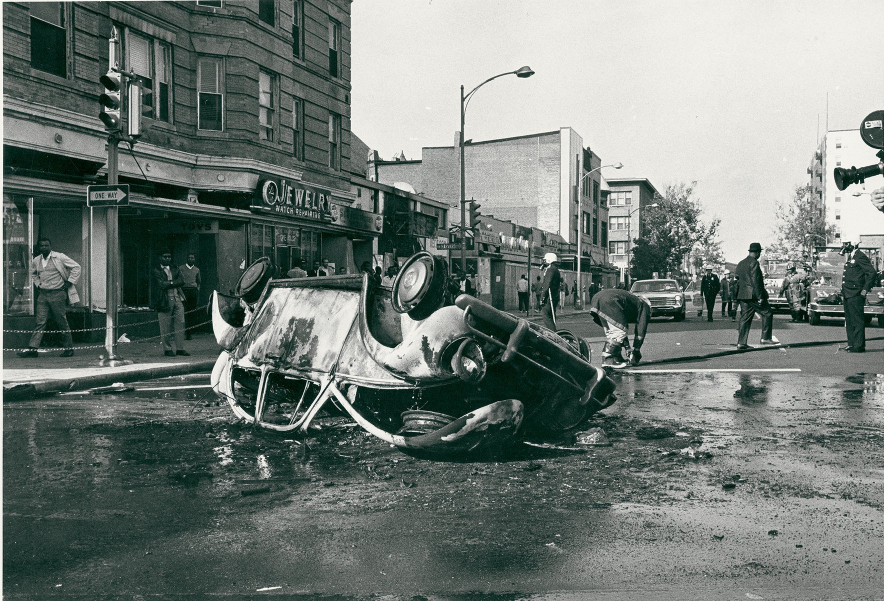 The city remained tense well after the initial destruction and chaos, with clashes still bubbling up. A car that was torched by a crowd at 14th and Harvard in November 1968. Photograph by Washington Post. Reprinted with Permission of DC Public Library/Star Collection. 