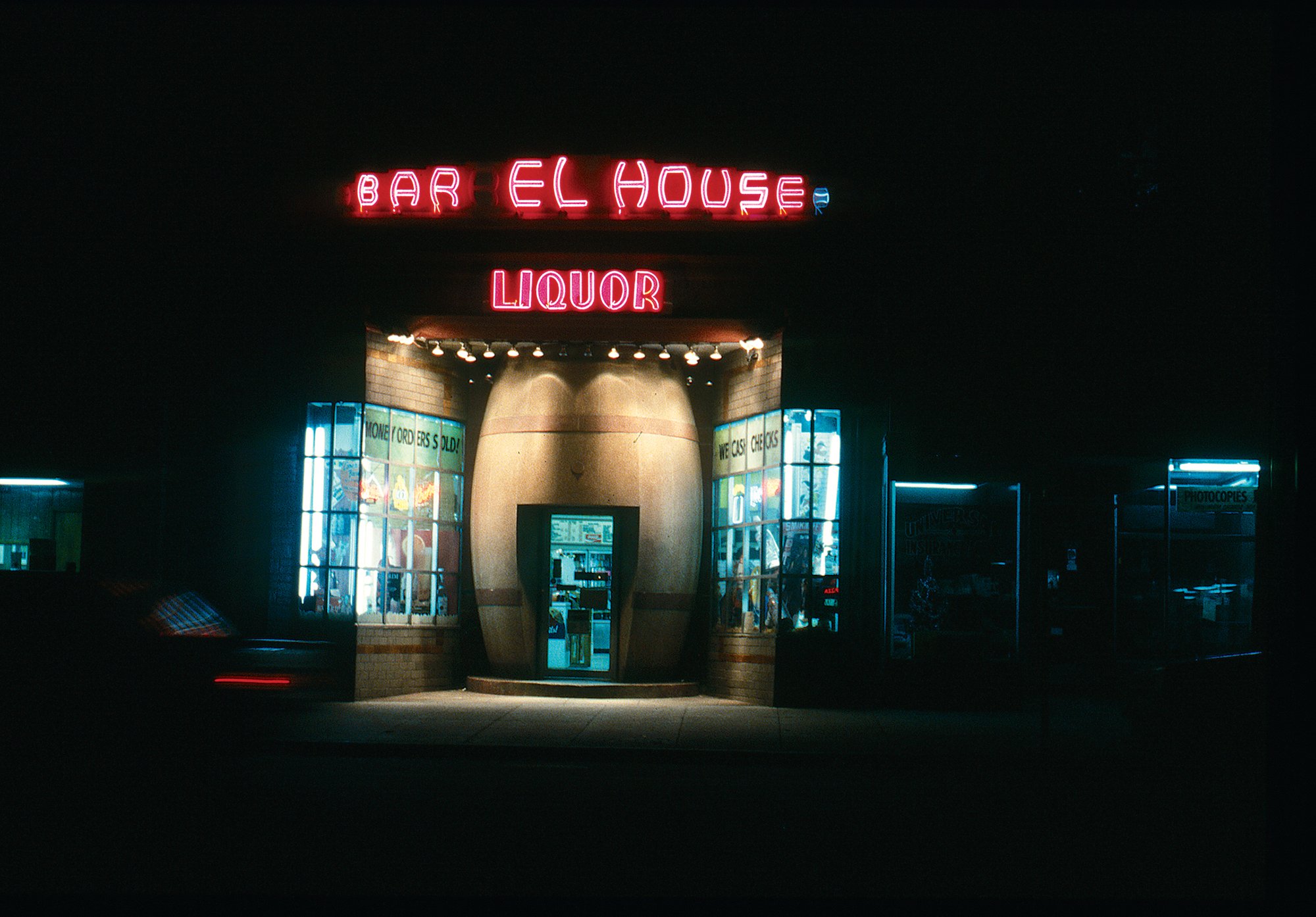 The street had been written off as full of drugs and crime. But it wasn’t entirely desolate. Barrel House Liquors did a steady business in the ’70s. Its owner stayed afloat in part by acting as his own security. Other neighbors took more creative approaches: Below, a sticker that a local group used to slap onto the cars of johns cruising for prostitutes. Photograph by Michael J. Horsley and by Steve Szabo/Washington Post via Getty Images.