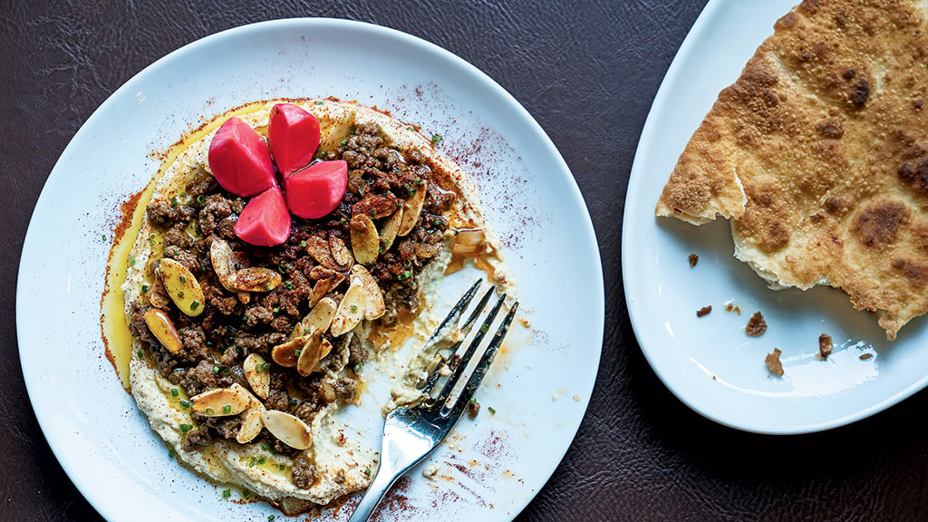 Hummus with sautéed beef and snowshoe naan at the eclectic new Chloe. Photograph by Scott Suchman.