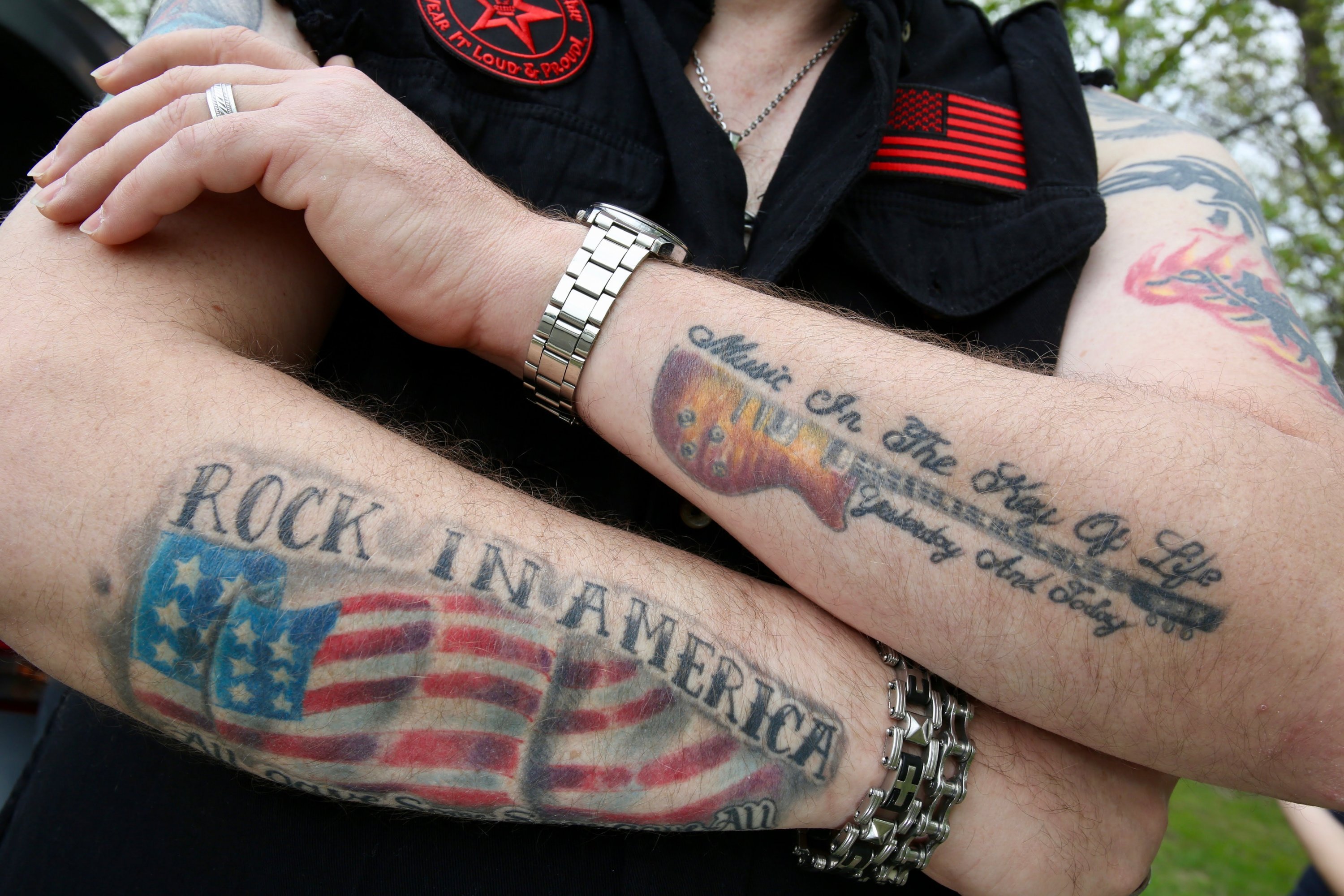 Garry has a lot of tattoos that show off the various metal concerts he's attended. 