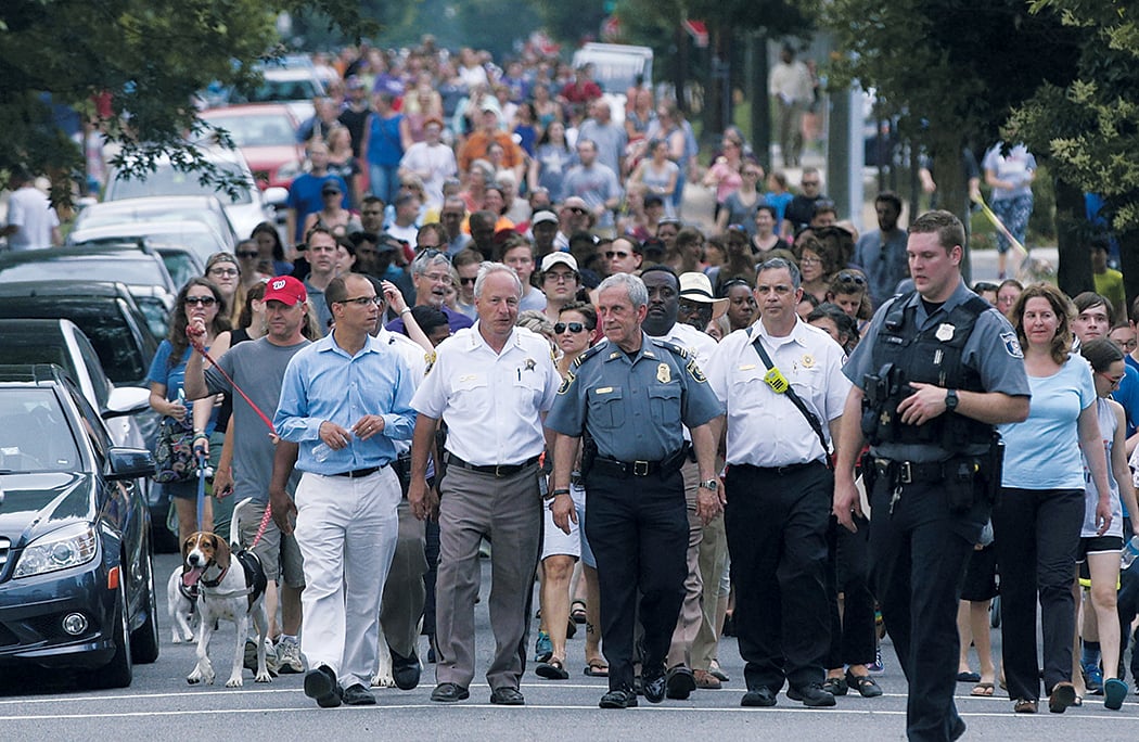 Alexandria residents staged an impromptu solidarity walk to a local church. Photograph of by Tom Williams/CQ Roll Call.