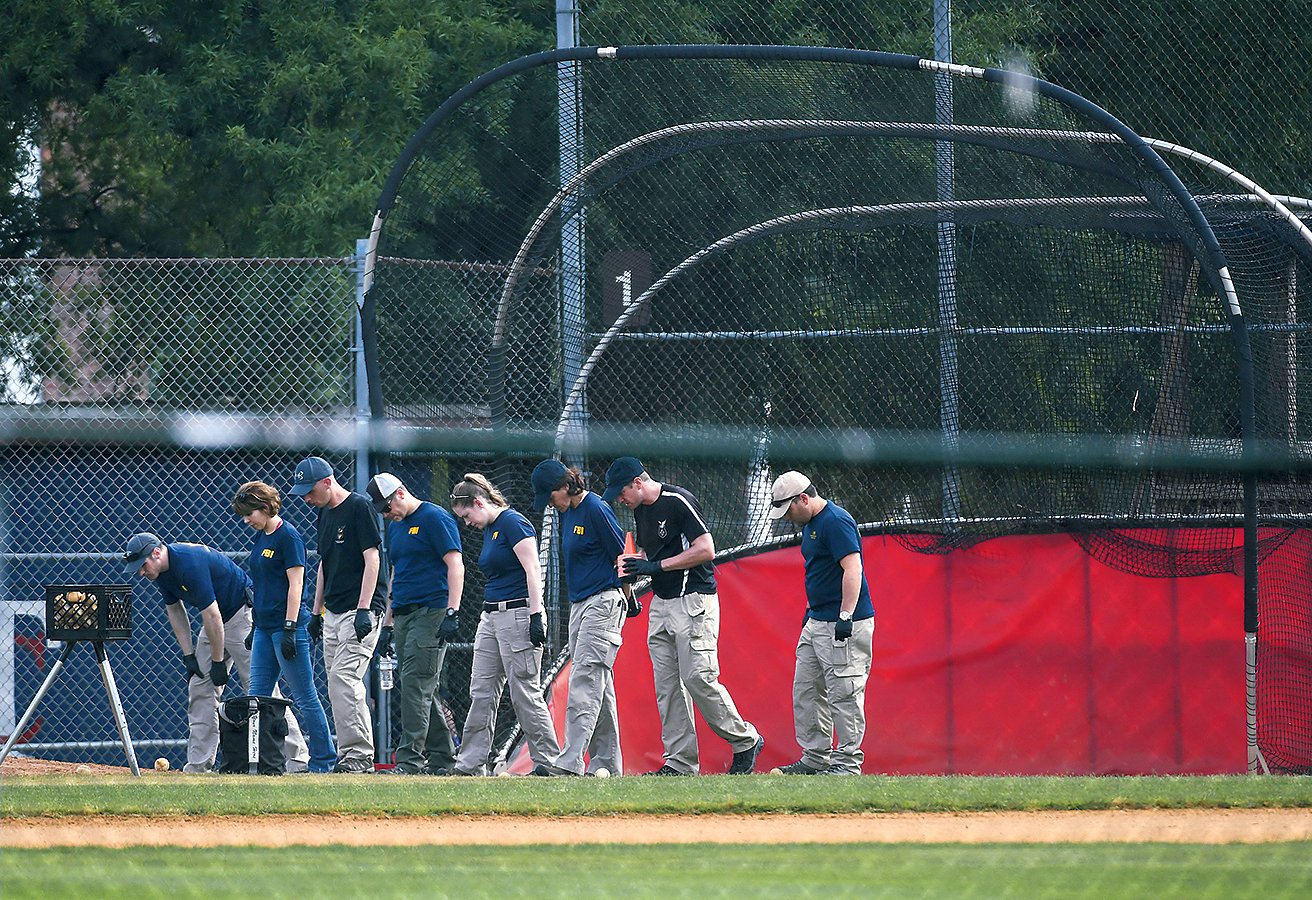 Dozens of federal, state, and local agents descended on the scene. Photograph of agents by Matt McClain/Washington Post via Getty Images.