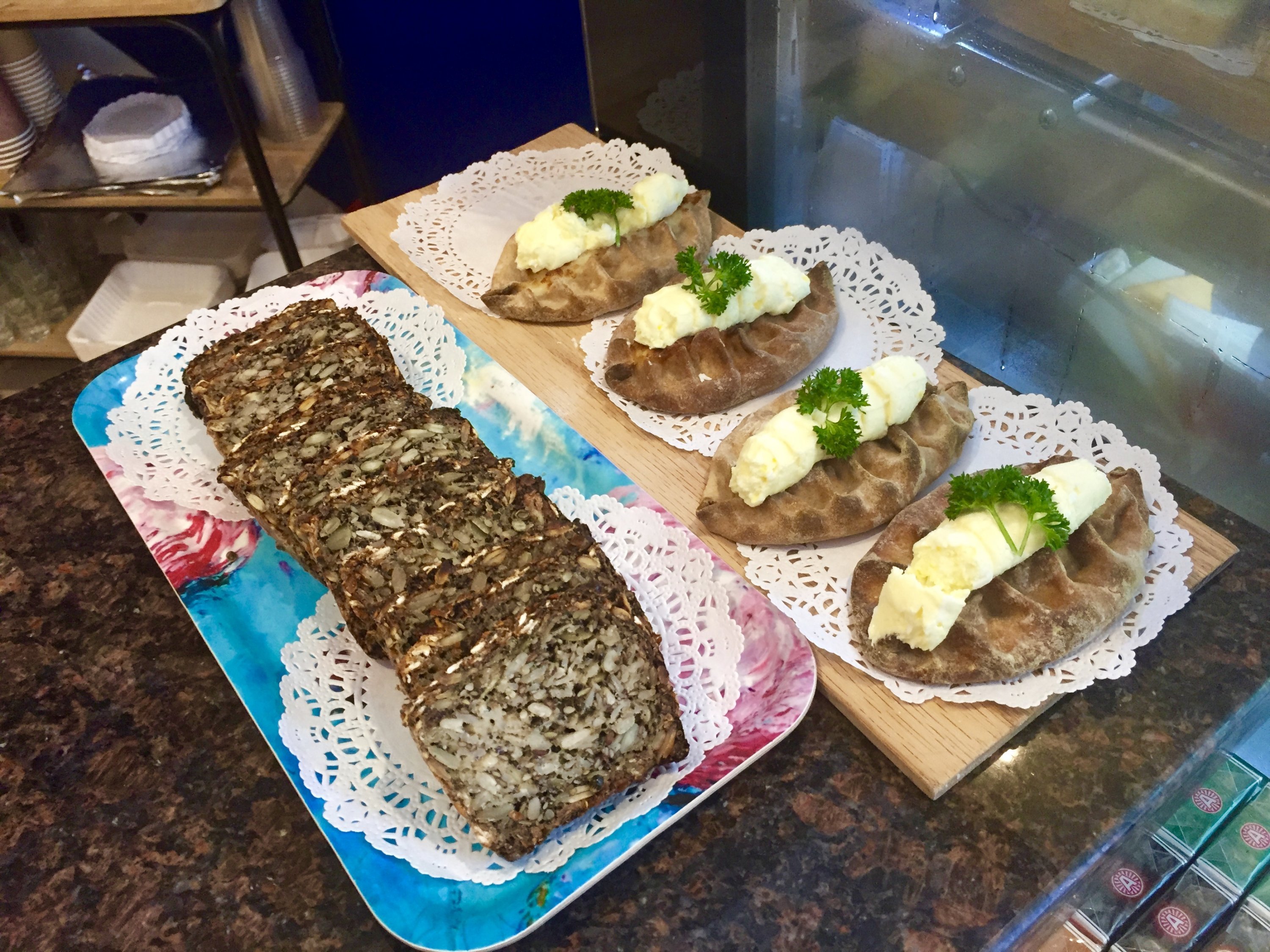 The café serves various Nordic pastries and breads, such as seven seed bread (left) and Karelian pastries topped with egg butter and filled with rice porridge (right). Photograph by Helen Carefoot.