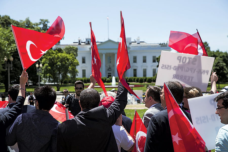 Supporters of Turkish leader Recep Tayyip Erdogan demonstrate outside the White House on May 16, 2017. Photograph by Samuel Corum/Anadolu Agency/Getty Images.