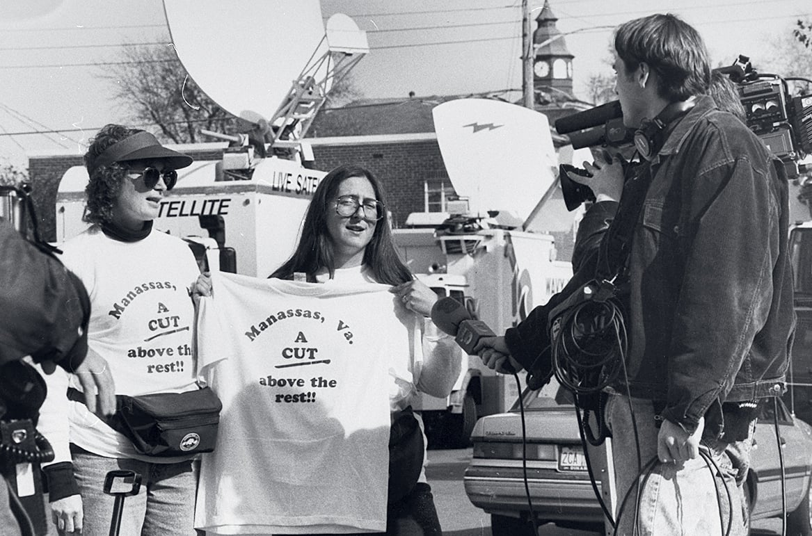 Arlene Banton (left) and Windy Shepley being filmed by media while hawking t-shirts. Photograph by Robert Sherbow/ LIFE Images Collection/Getty Images.