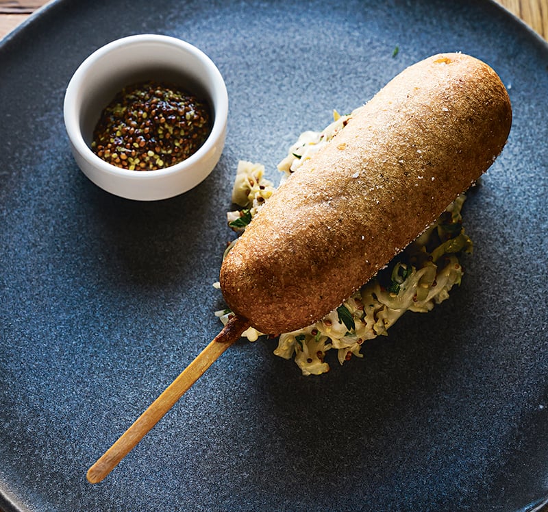 AhSo’s goat-sausage-stuffed corn dog.