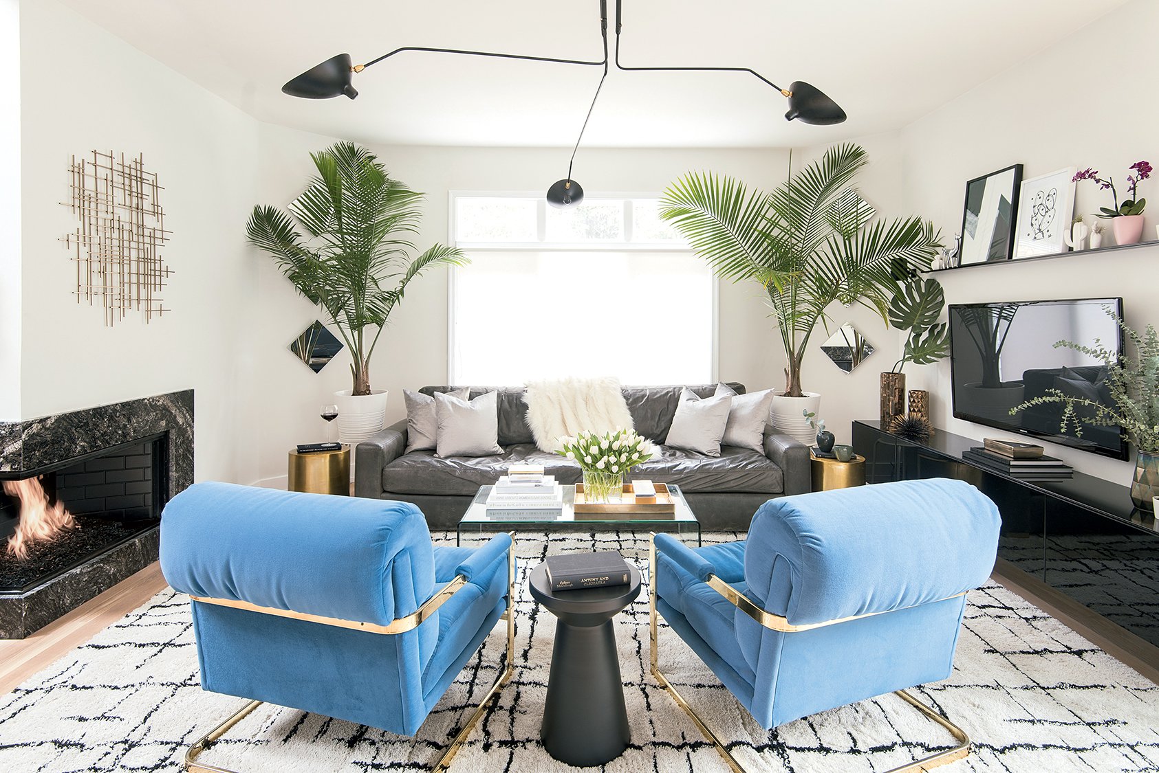 The pair of vintage blue chairs, also by Baughman, are another eBay find. The leather Restoration Hardware sofa came from Craigslist.