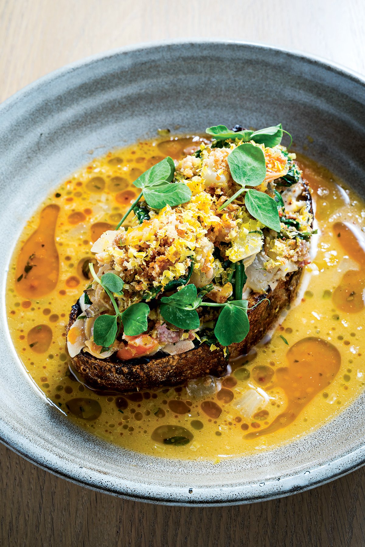 Creamy, briny clam toast. Photograph by Scott Suchman.