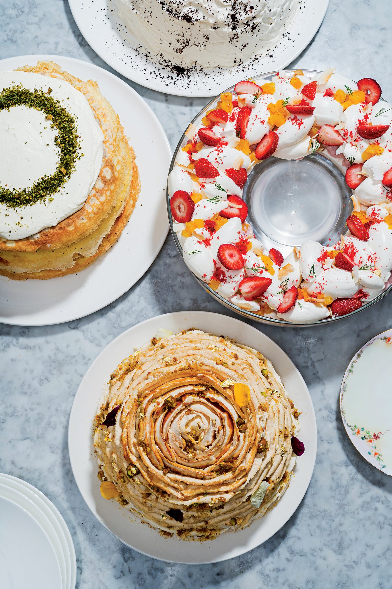 Pichet Ong’s cakes at Brothers and Sisters, including a layering of crepes with Earl Grey cream called the London (far left) and the fruit-topped Cancún, a take on tres leches.