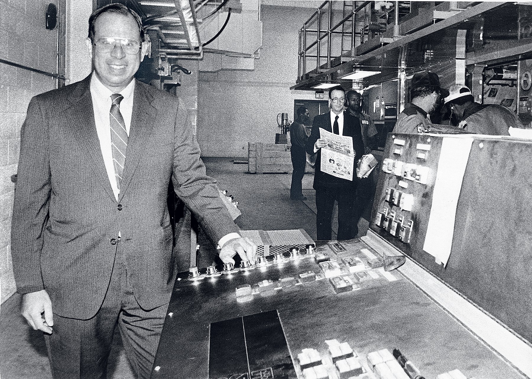 The author’s father, Phil Merrill, starts the presses in the 1980s. Photograph courtesy of Catherine Merrill Williams.