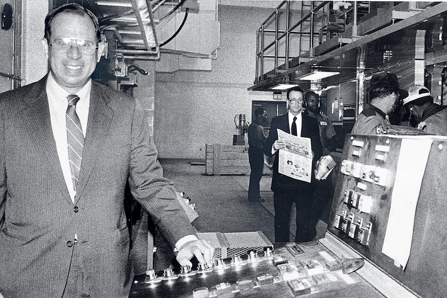 The author’s father, Phil Merrill, starts the presses in the 1980s. Photograph courtesy of Catherine Merrill Williams.