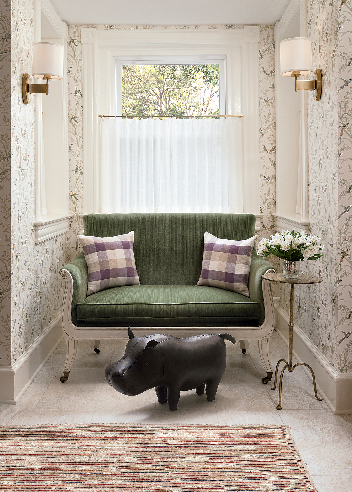 Annie Elliott brought a lower-level space out of its dark, Victorian-era rut with fresh wallpaper, light tile, and well-proportioned furniture. Photograph by Jenn Verrier.