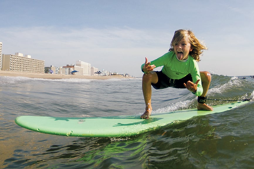 Photograph of surfer courtesy of 17th Street Billabong Surf Camp.