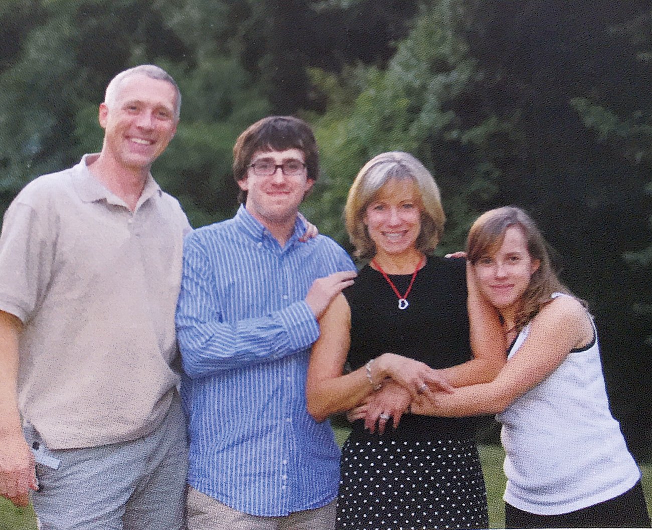 Collin's first donor heart ended up seeing him through high school and into his early 20s. In this photo from his high-school graduation party, he's with his parents, Mark and Suzanne Kobelja, and his sister, Mary. Photograph courtesy of Collin Kobelja.