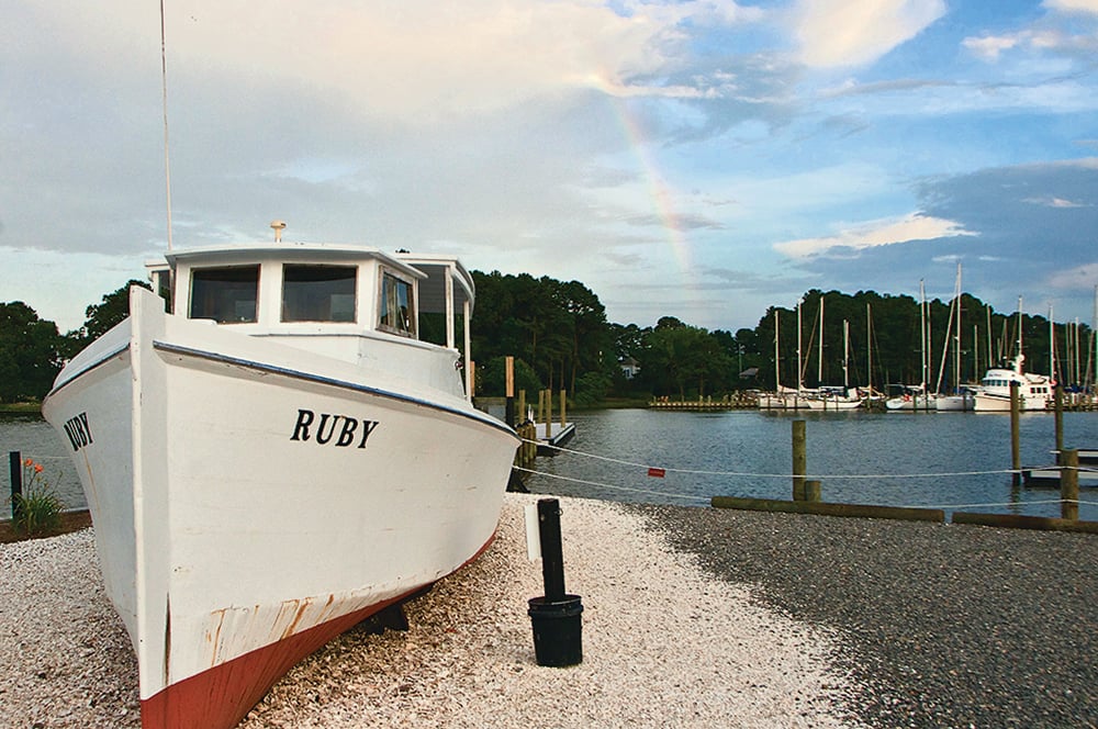 FWO1 - Washingtonian Northern Neck, Virginia Oysters. The retired deadrise workboat Ruby decorates Merroir’s waterfront promenade.
