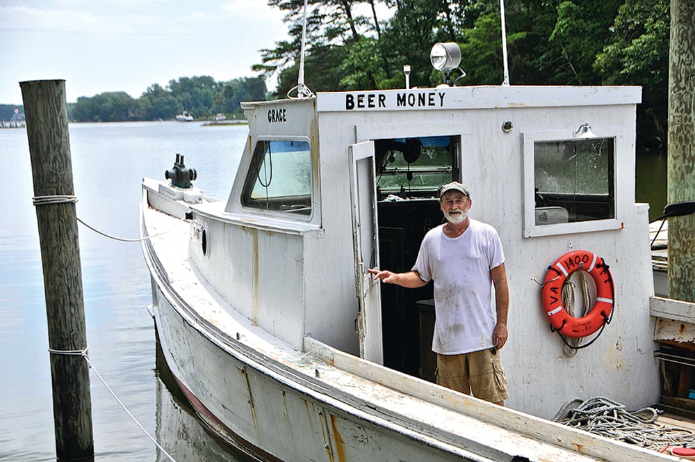 Northern Neck, Virginia Oysters. Coates aboard his curiously named workboat.