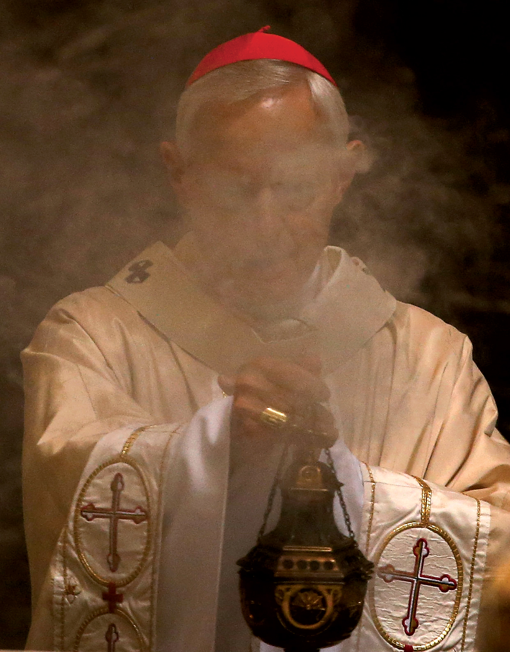 Cardinal Wuerl conducting Mass in DC. Photograph by Mark Wilson/Getty Images.