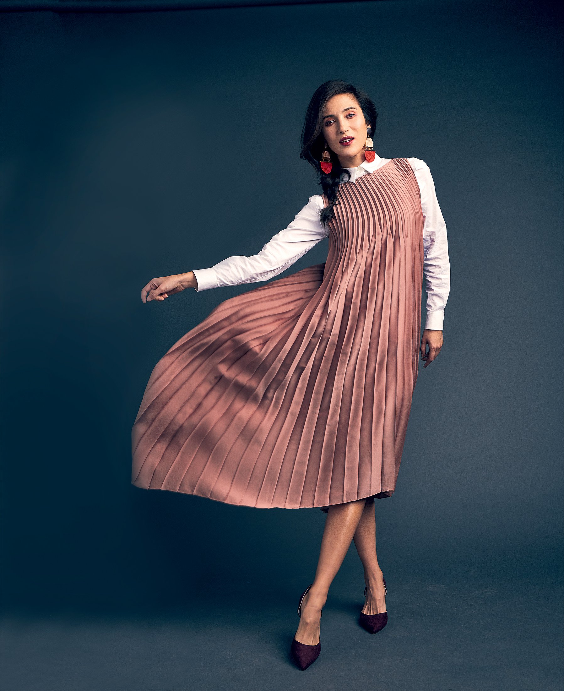 WS1 - Washingtonian White shirt, 0 at Anne Fontaine; chevron pleated dress, 5 at Vince; pendant earrings, 0 at makua.co; pumps, .99 at H&M.