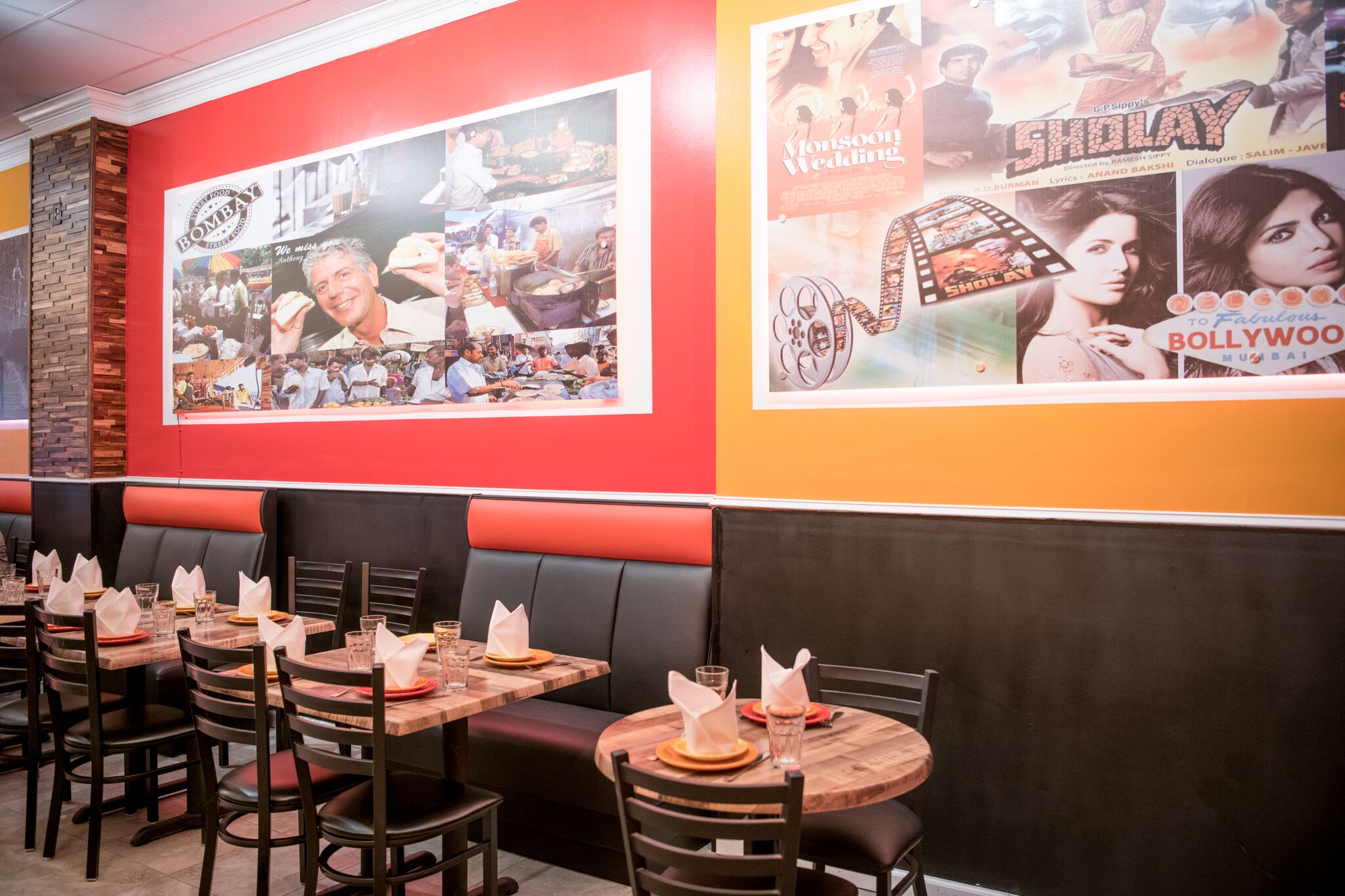 dining interior - Washingtonian Anthony Bourdain and Bollywood are celebrated on the walls. Photograph by Emma McAlary.