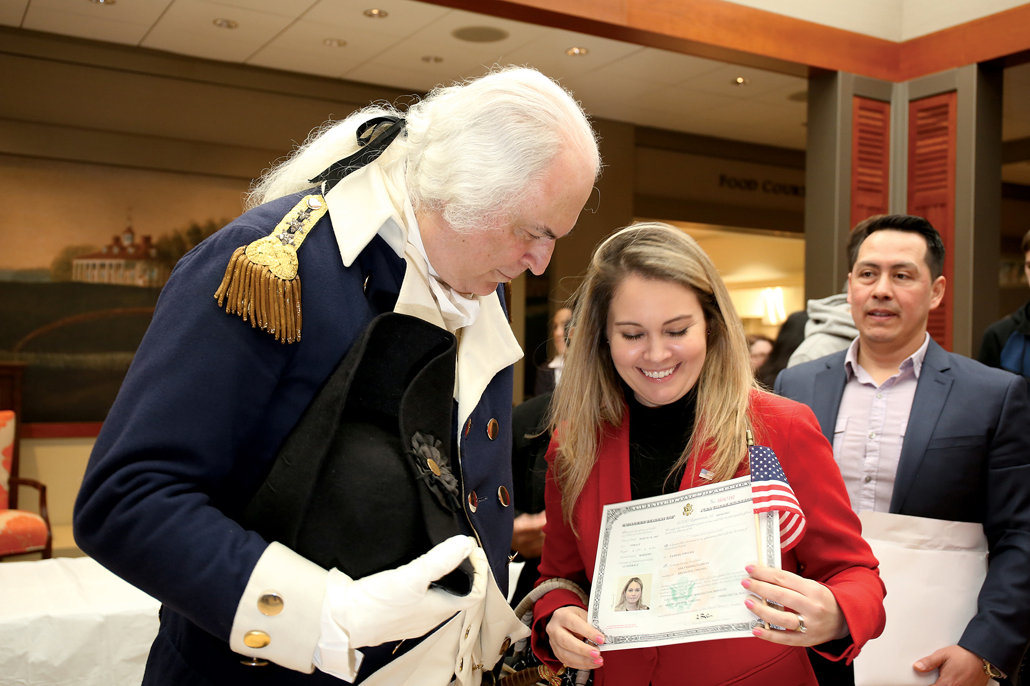 Photographs of Immigrants Becoming U.S. Citizens: Mount Vernon, February 22, 2018. After receiving their paperwork, new citizens ate a cake in honor of George Washington’s 286th birthday.