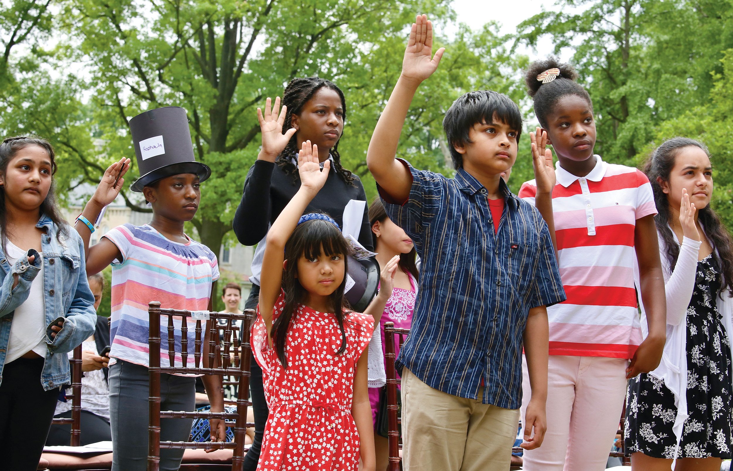Photographs of Immigrants Becoming U.S. Citizens: President Lincoln’s Cottage, May 31, 2018. Kids were given a chance to make stovepipe hats in honor of the 16th President.