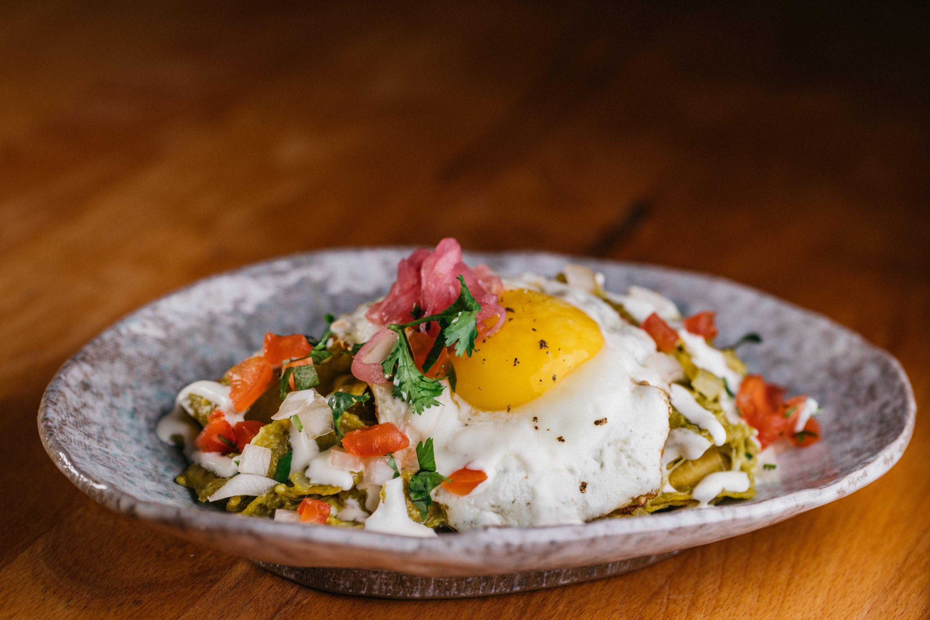 Chilaquiles are part of Buena Vida's unlimited small plates deal. Photograph courtesy of Buena Vida. 