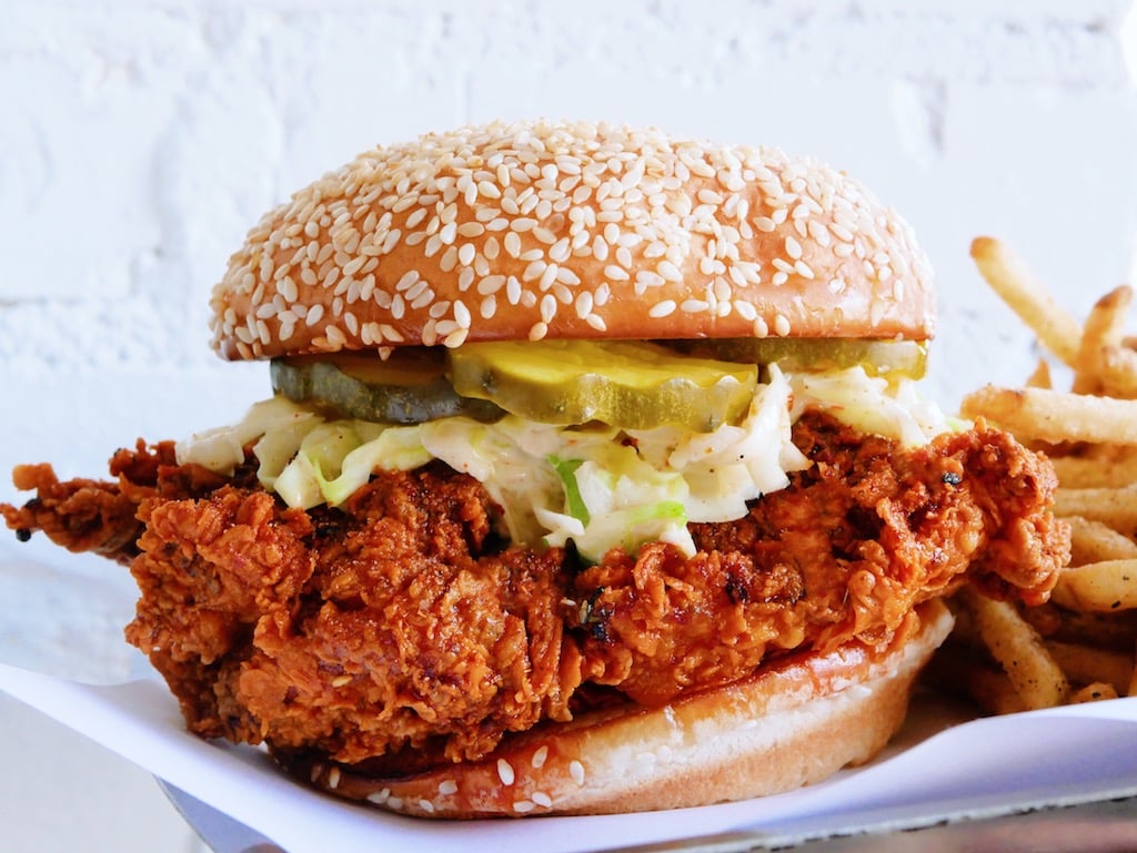 Hot Lola’s spicy fried chicken sandwich with a chicken fat-griddled bun, ho...