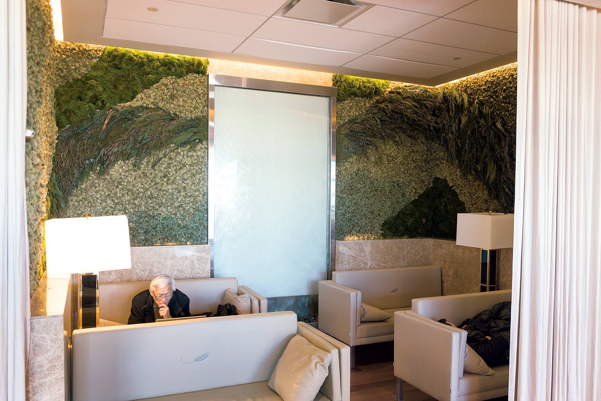 The Turkish Airlines lounge at Dulles features a moss wall and a waterfall, sushi at the buffet, and freshly made baklava. Photograph by Lauren Bulbin.