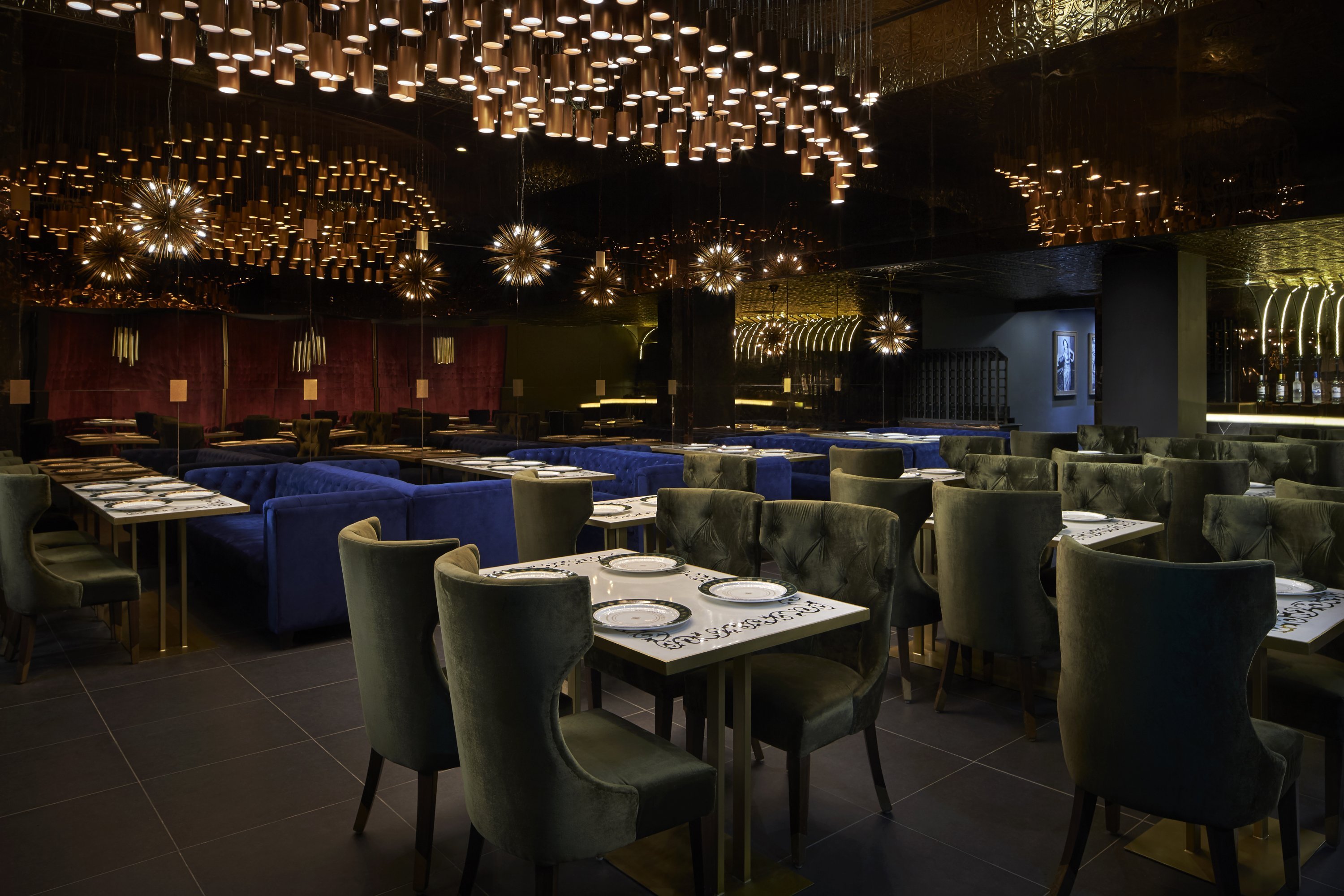 The dining room is dotted with touches of velvet and a chandelier with 380 lights. Photograph by Greg Powers.