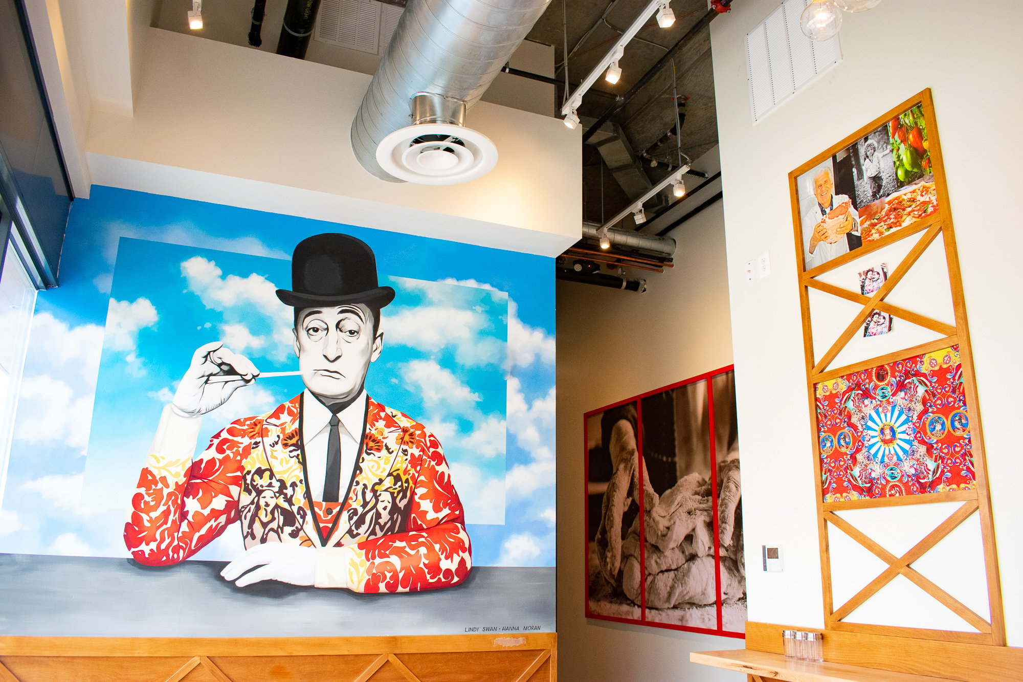 A painting of Italian comedian Totò in a Dolce & Gabbana jacket adorns the wall. Photograph by Meaghan Webster. 