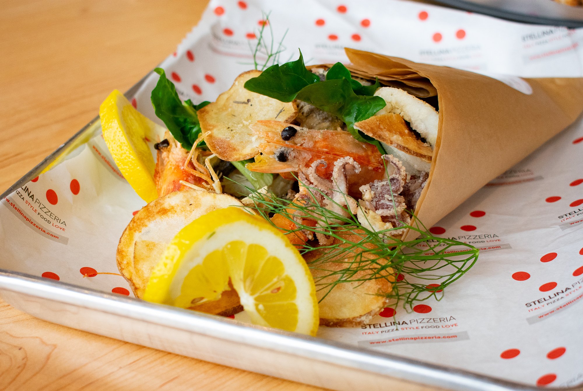 DSC_0139 - Washingtonian Seafood fritto misto is served in a paper cuoppo, inspired by Venini's trip to Puglia. Photograph by Meaghan Webster.
