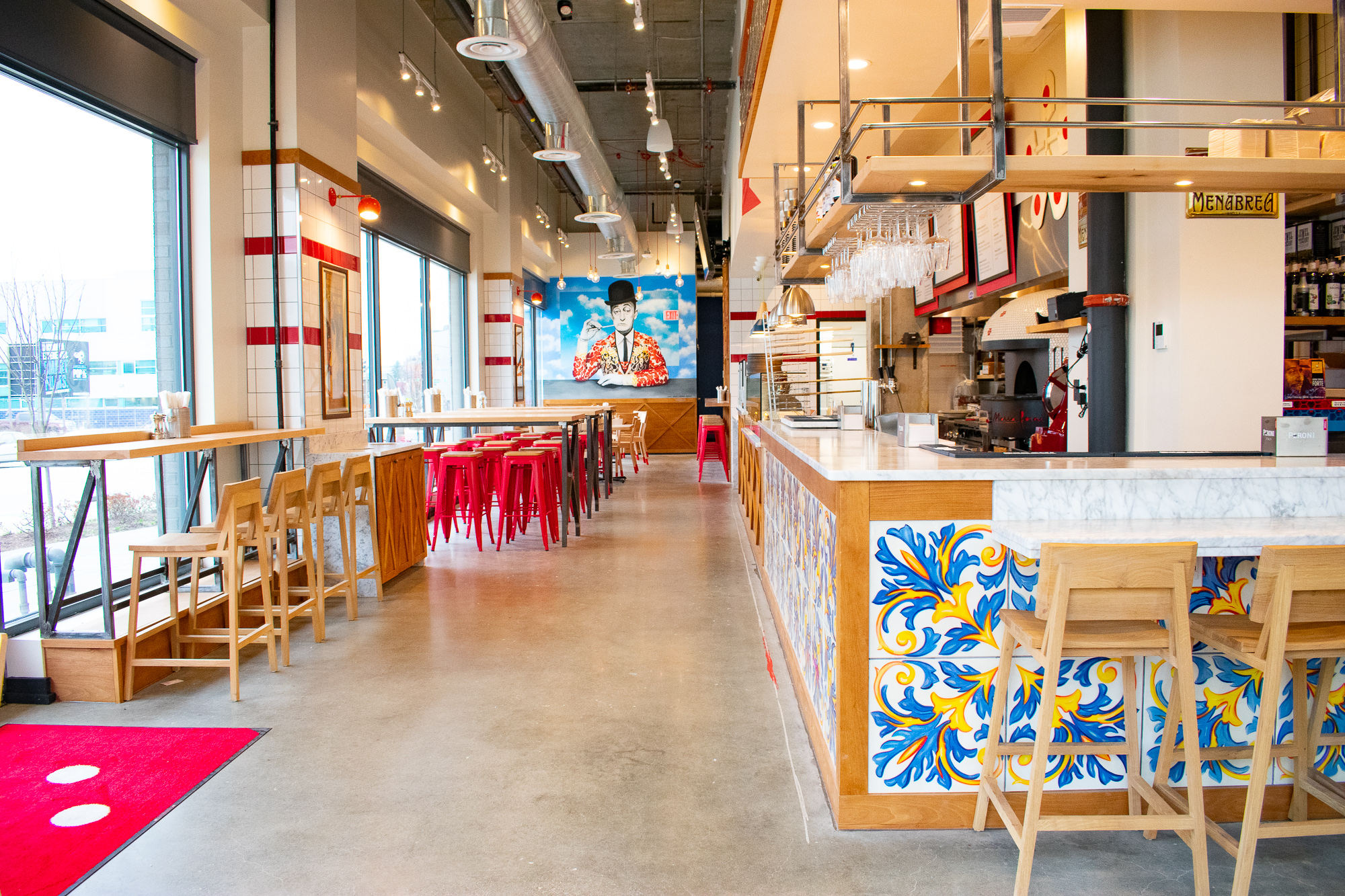 The red and white decor is reminiscent of pizzerias in Naples while the blue and yellow tiling calls to Matarazzo's connection to the Amalfi Coast. Photograph by Meaghan Webster.