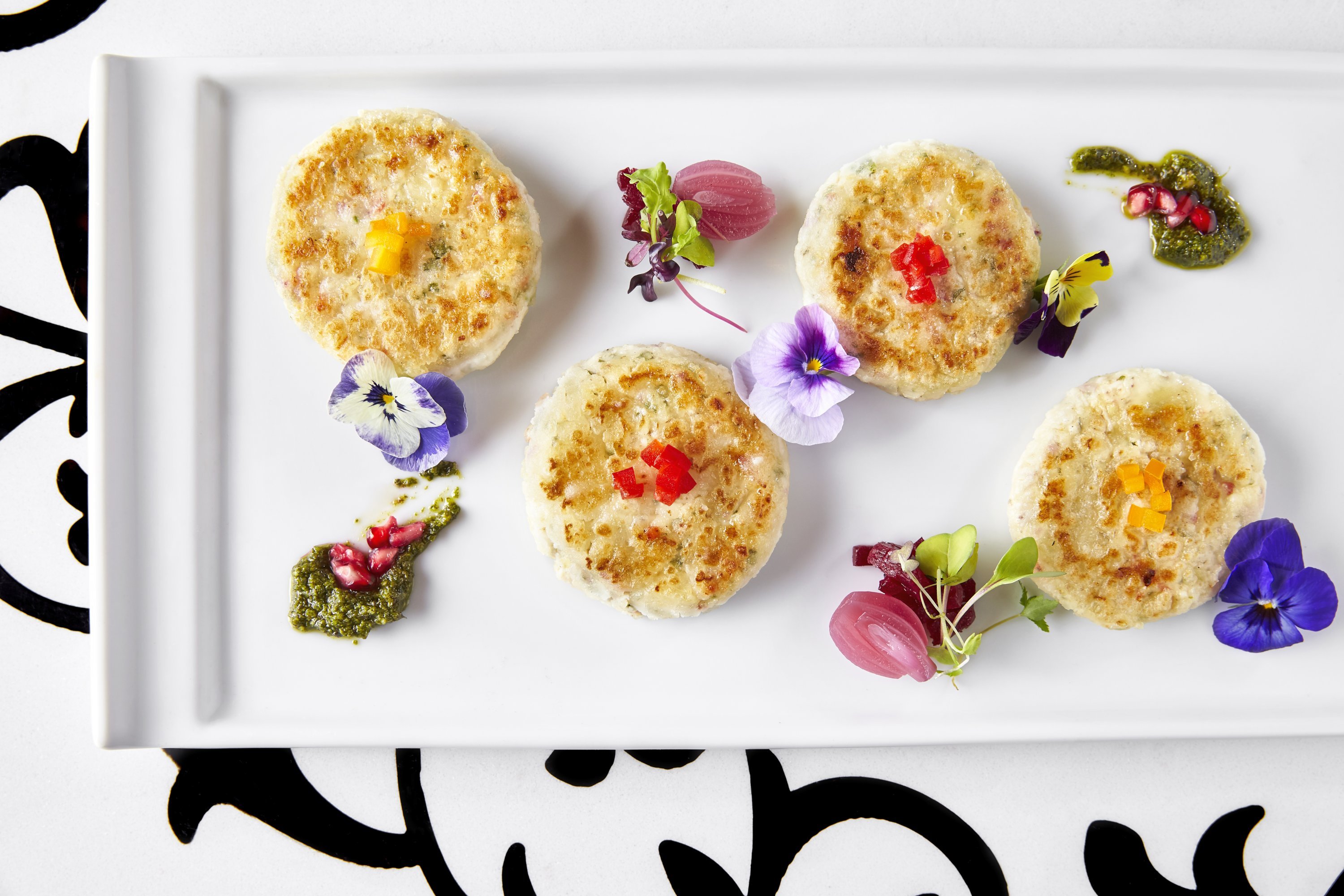 Dahi Ke Kebab - Washingtonian Pan fried Dahi Ke Kebab is a hot appetizer with mint and pomegranate dip. Photograph by Greg Powers.