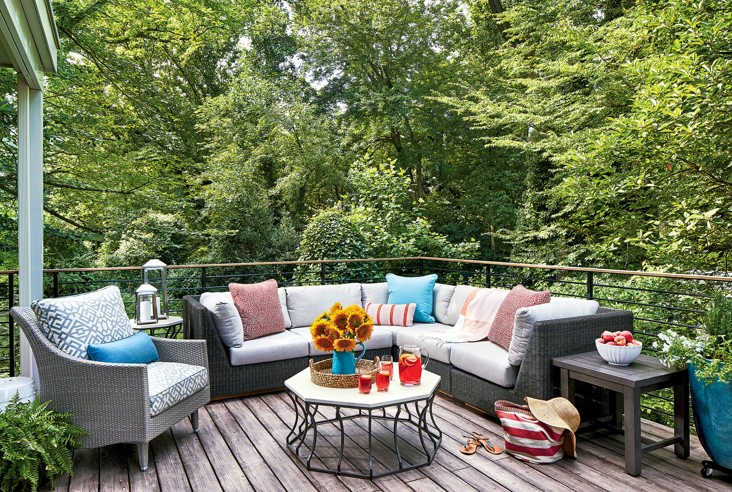 Durable pieces, such as weather-resistant wicker furniture, keep this deck both practical and stylish. Photograph by Stacy Zarin Goldberg.