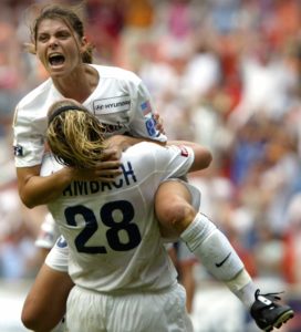 Mia Hamm in 2003, celebrating her goal for the Washington Freedom. AP Photo/Lawrence Jackson.