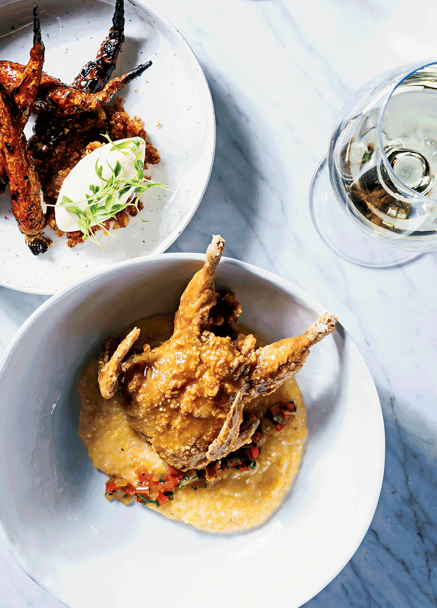 Plates of fried quail and barbecue carrots.