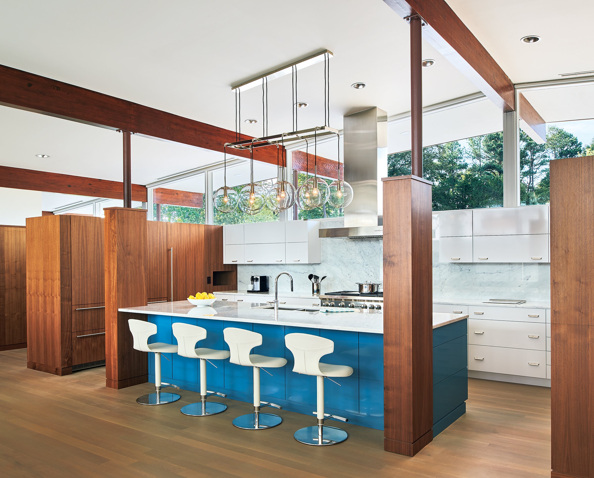 The owner chose the bold blue color of the island in the renovated kitchen.