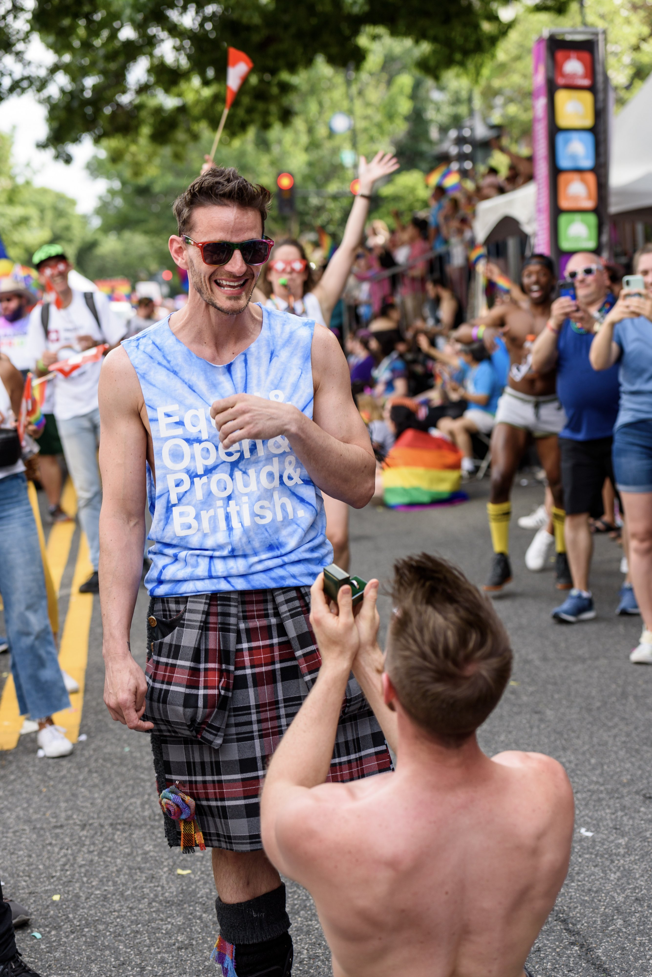 Pride Parade 2019-39 - Washingtonian Finley Wilson proposes to Alan Lambie during the parade. Photograph by Scott Marder.