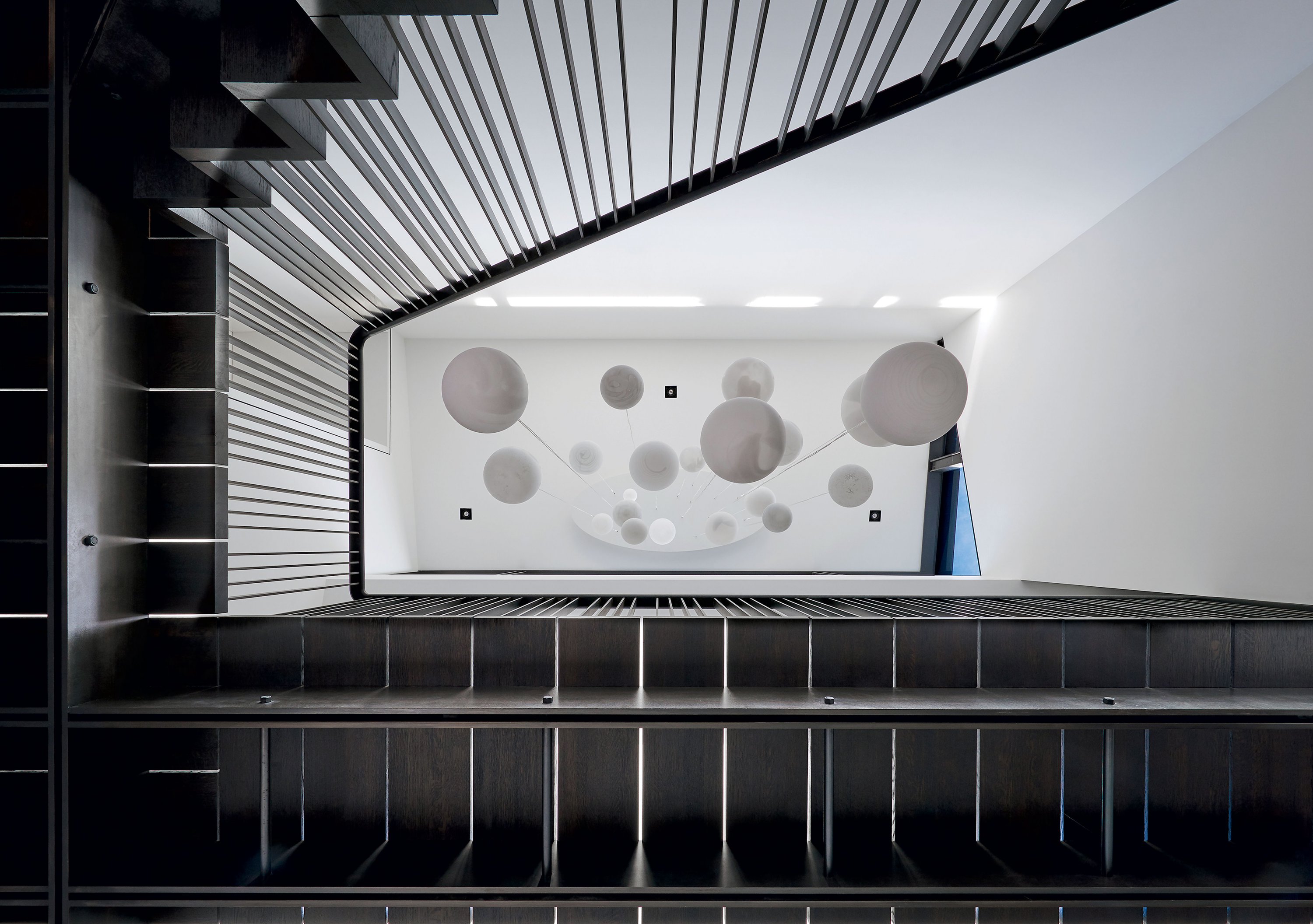 03_Renovation-on-Coxs-Row.SPREAD - Washingtonian A skyward view through a staircase designed by architect Robert Gurney. Photograph by Anice Hoachlander.