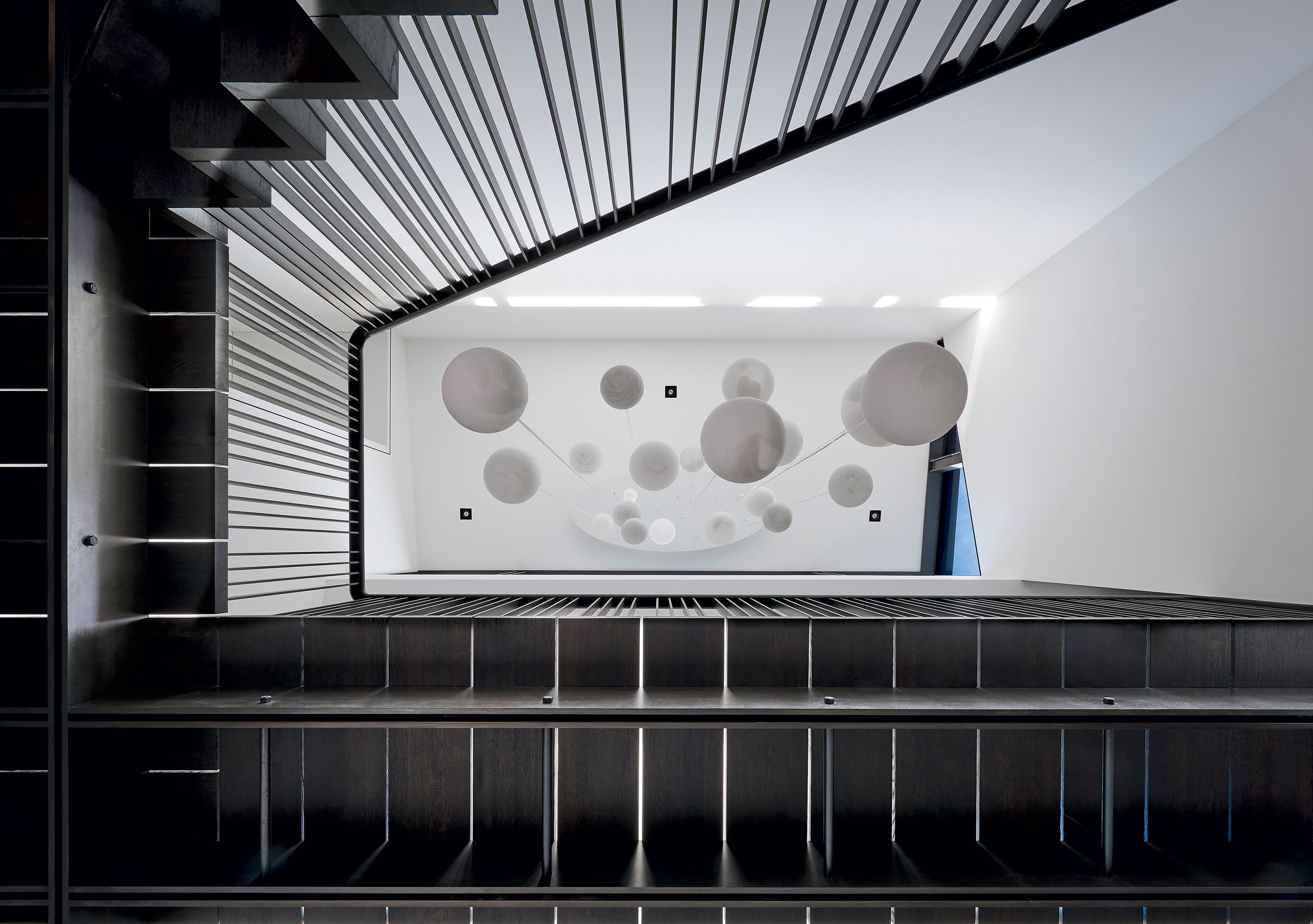 A skyward view through a staircase designed by architect Robert Gurney. Photograph by Anice Hoachlander.