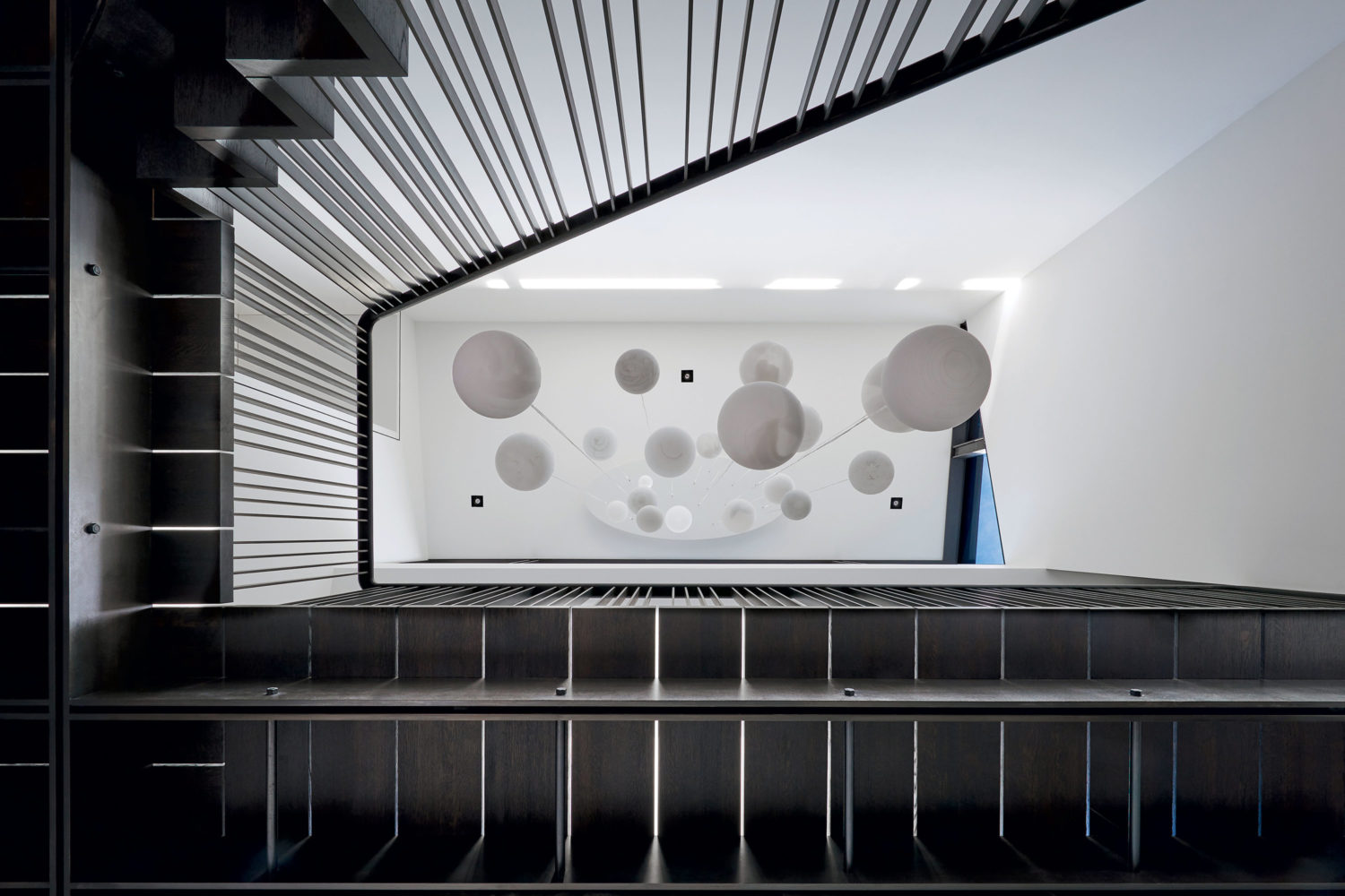 A skyward view through a staircase designed by architect Robert Gurney. Photograph by Anice Hoachlander/Hoachlander Davis Photography .