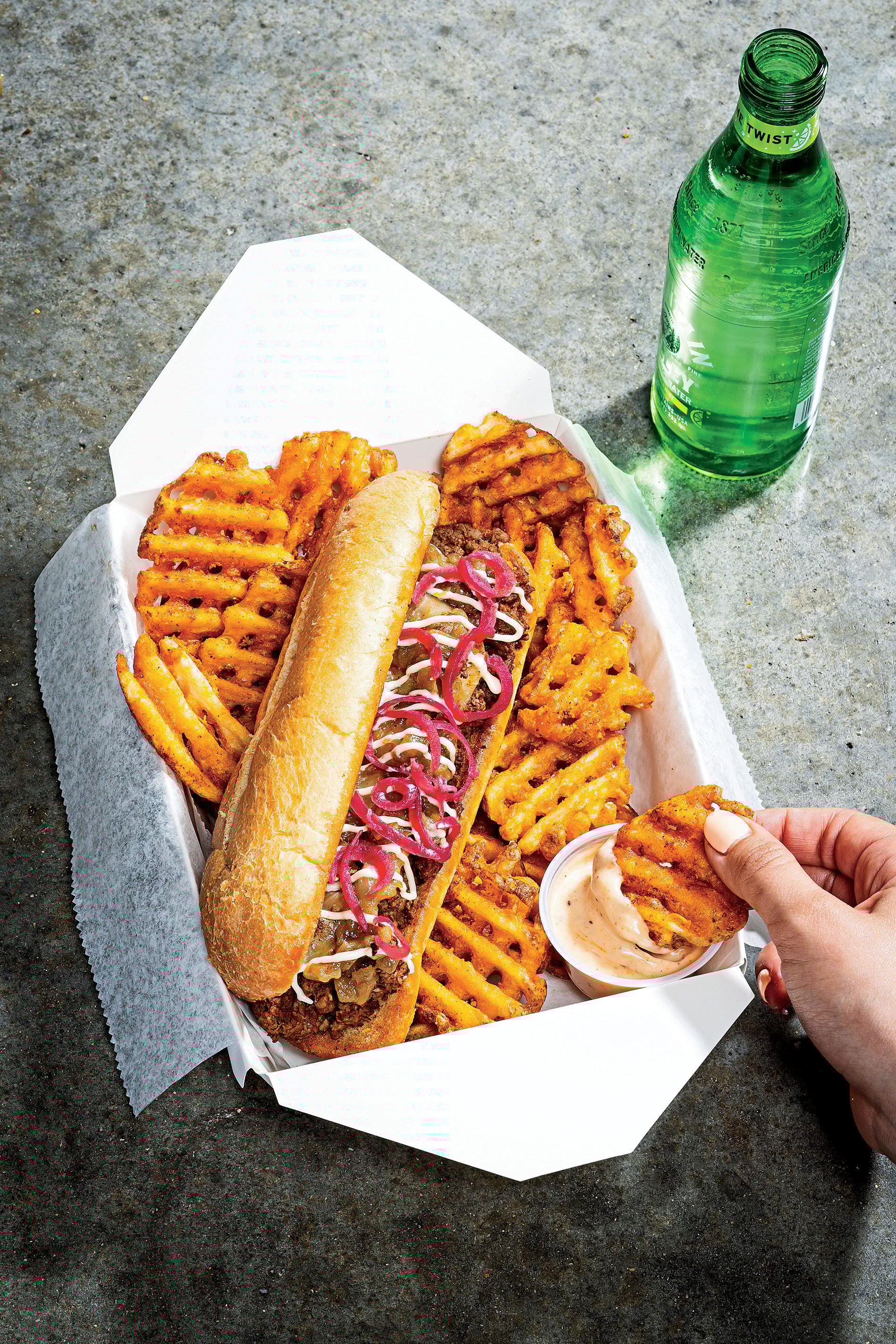 CE19-PhillyWingFry - Washingtonian Philly Wing Fry’s cheesesteak, made with dry-aged rib eye Food styled by Nichole Bryant at The Artist Agency.