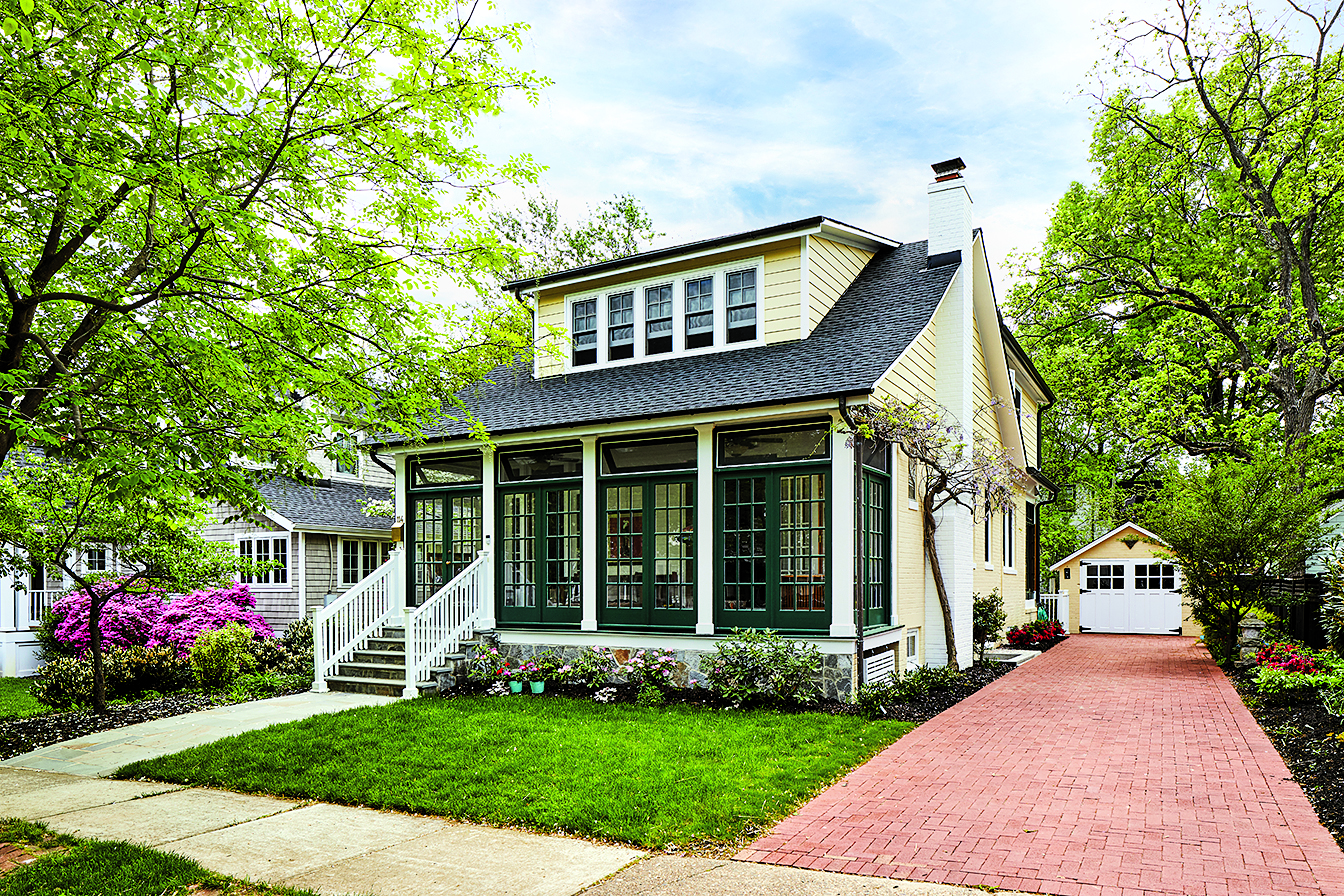 Out of the Box: Winn Design & Build expanded the Sears kit house with a modern kitchen whose details and color scheme recall the bungalow’s 1920s Craftsman roots. Photograph by Stacy Zarin Goldberg.